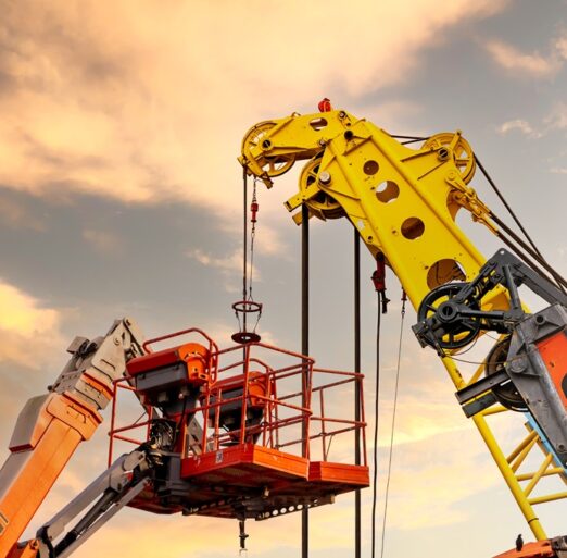 Articulated boom lift. Aerial platform lift and construction crane with sunset sky. Mobile construction crane for rent and sale. Maintenance and repair hydraulic boom lift service. Crane dealership.
